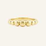 Yellow gold geometric domed ring front view on white background