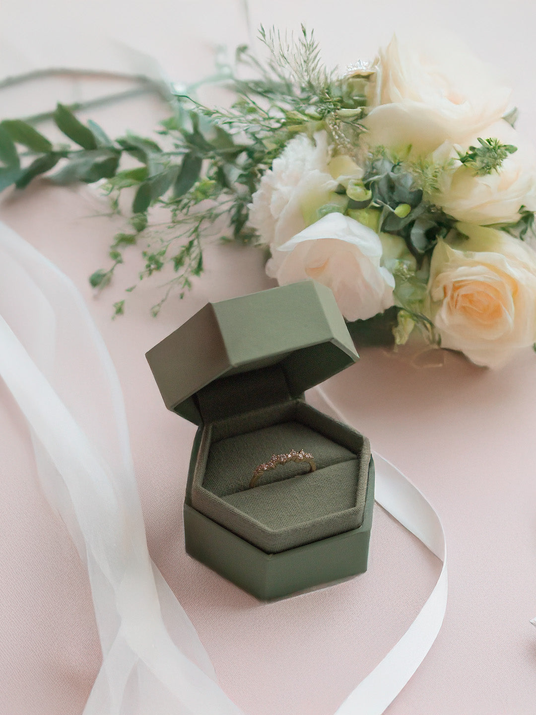 Sullivan Matte Single Ring Box with ring lifestyle photo on pink background with flowers