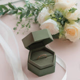 Sullivan Matte Single Ring Box with ring lifestyle photo on pink background with flowers