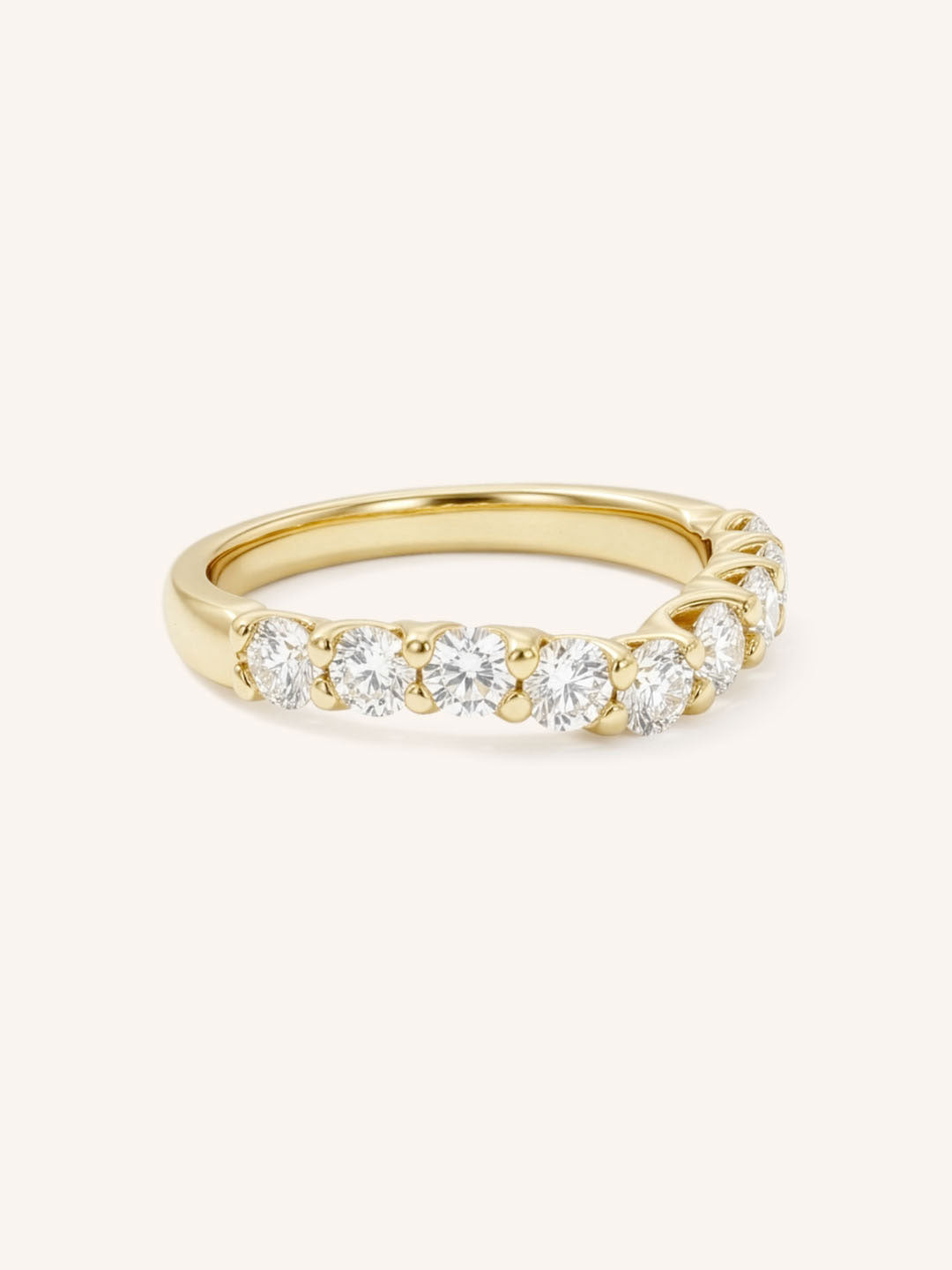 Yellow gold Lavale curved diamond wedding band side view on white background