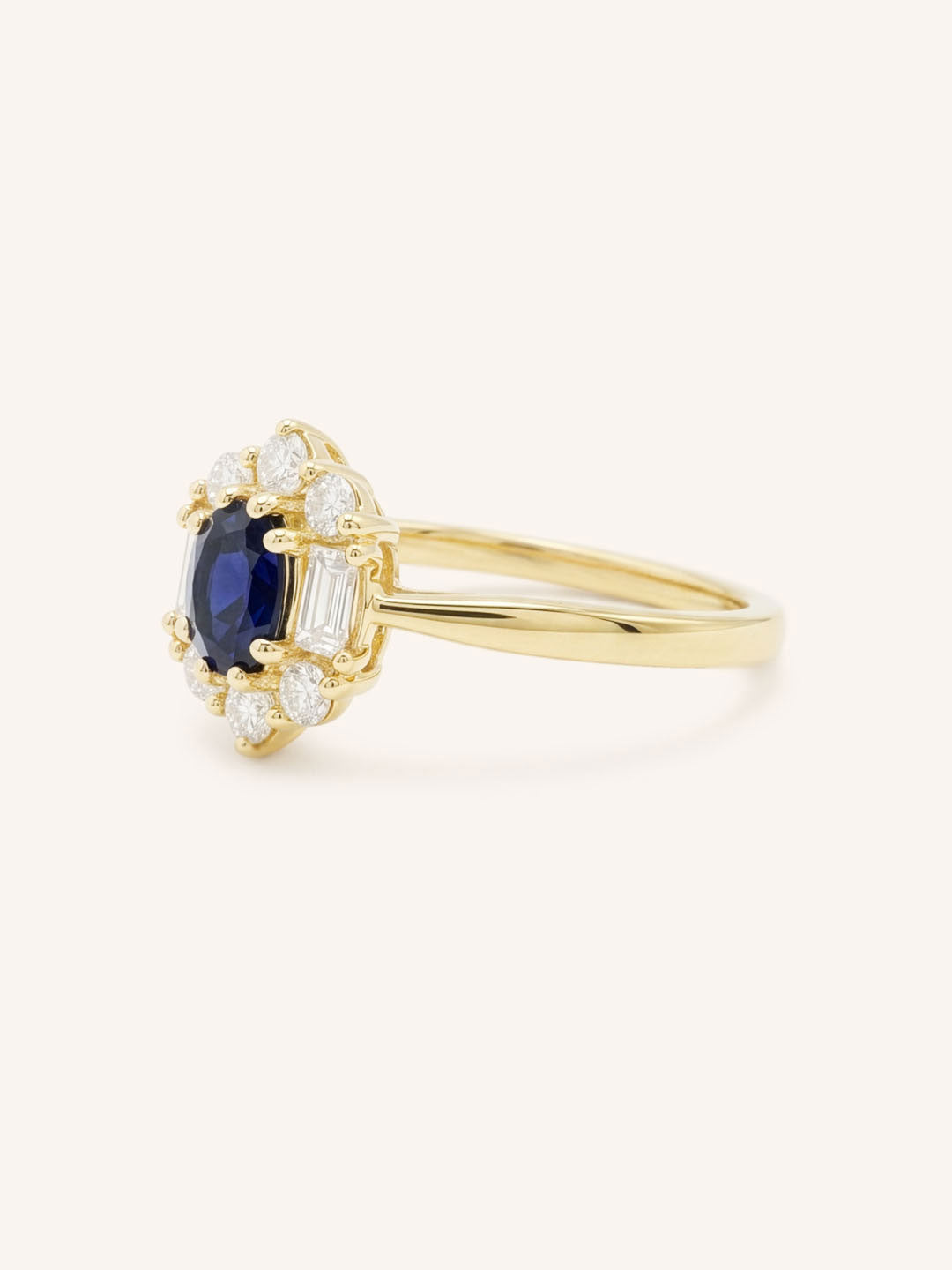 Yellow Gold Wyona Oval Blue Sapphire Halo Style Ring side view on white background