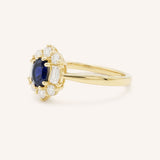Yellow Gold Wyona Oval Blue Sapphire Halo Style Ring side view on white background