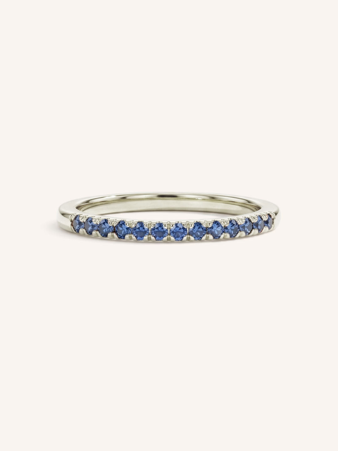 White Gold Blue Sapphire Birthstone Stackable Ring front view on white background