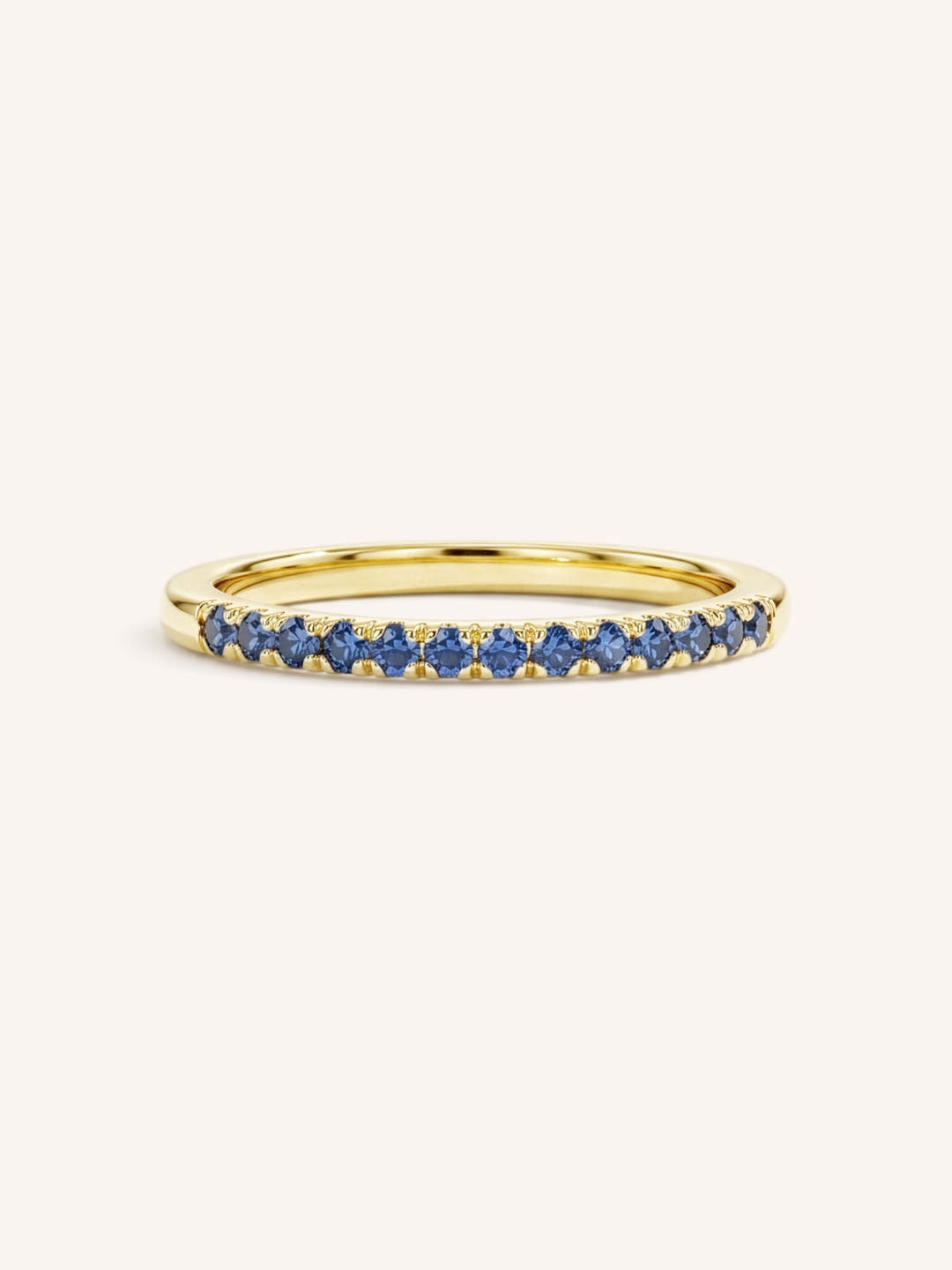 Yellow Gold Blue Sapphire Birthstone Stackable Ring front view on white background