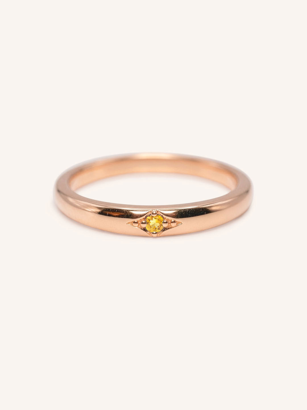 Rose gold Beacon citrine stackable ring front view on white background