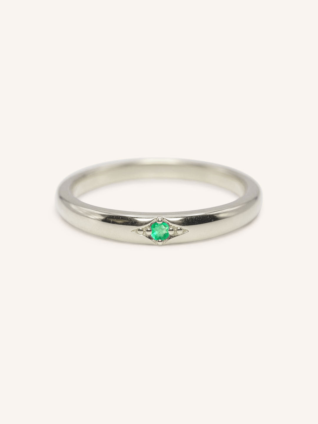 White gold Beacon emerald stackable ring front view on white background