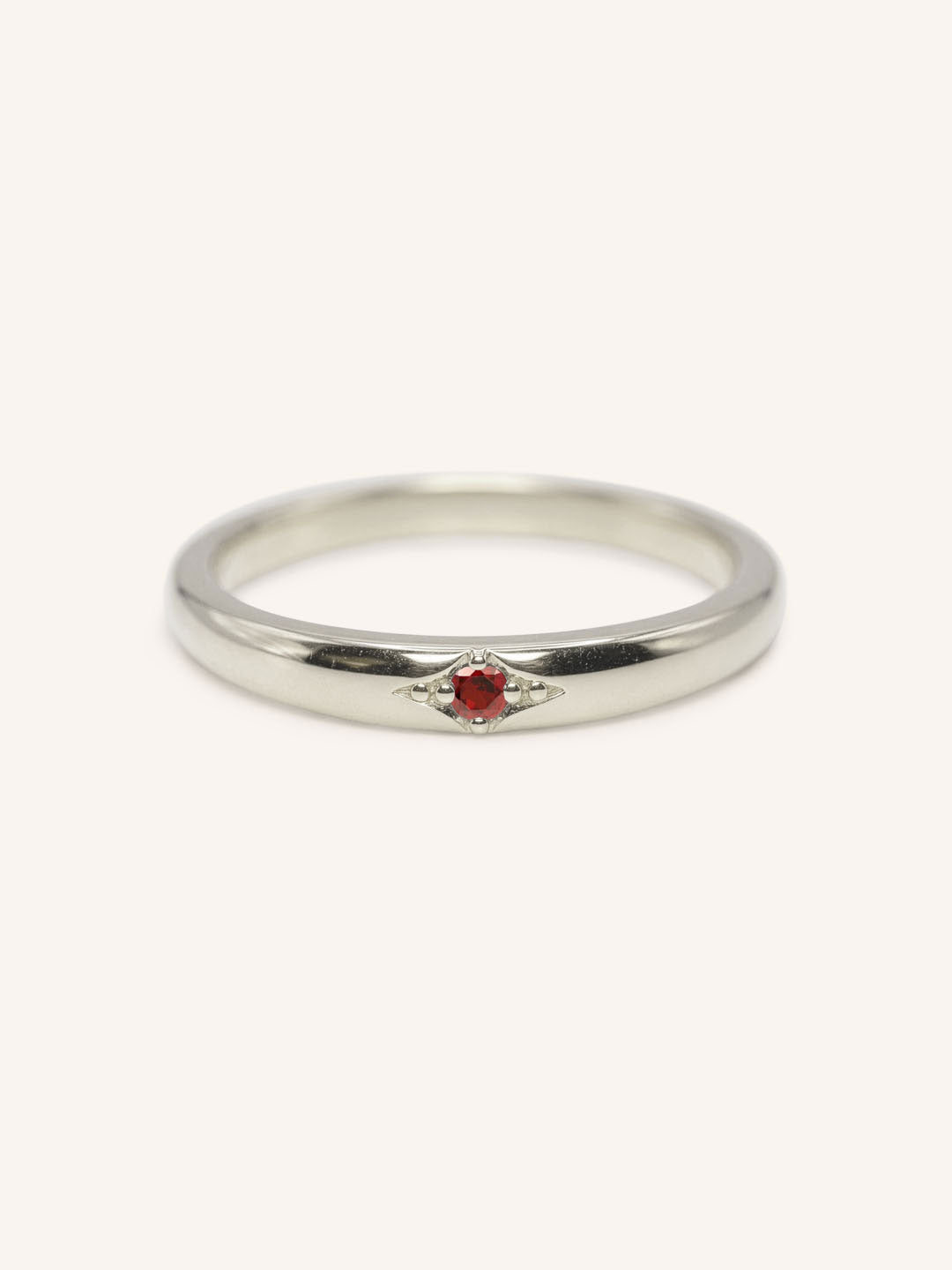 White gold Beacon garnet stackable ring front view on white background