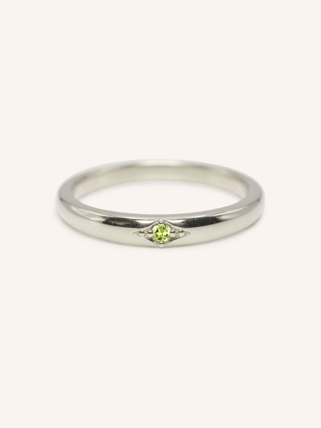 White gold Beacon peridot stackable ring front view on white background