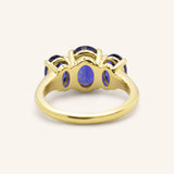 Trielle Three Stone Oval Cut Blue Sapphire Ring