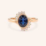 Rose gold Marlowe oval blue sapphire cluster diamond ring front view on white background