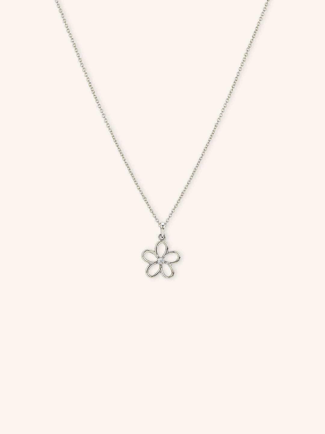 White gold necklace with a flower pendant on a white background