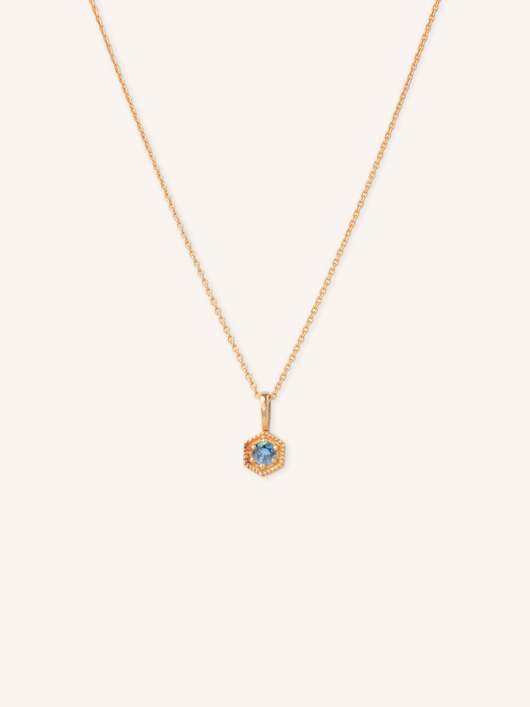 Rose gold Marigold Montana sapphire pendant necklace on white background
