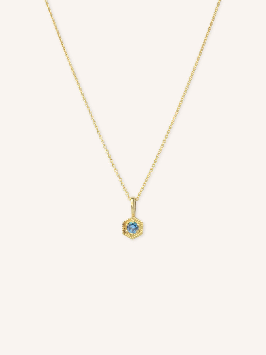 Yellow gold Marigold Montana sapphire pendant necklace on white background