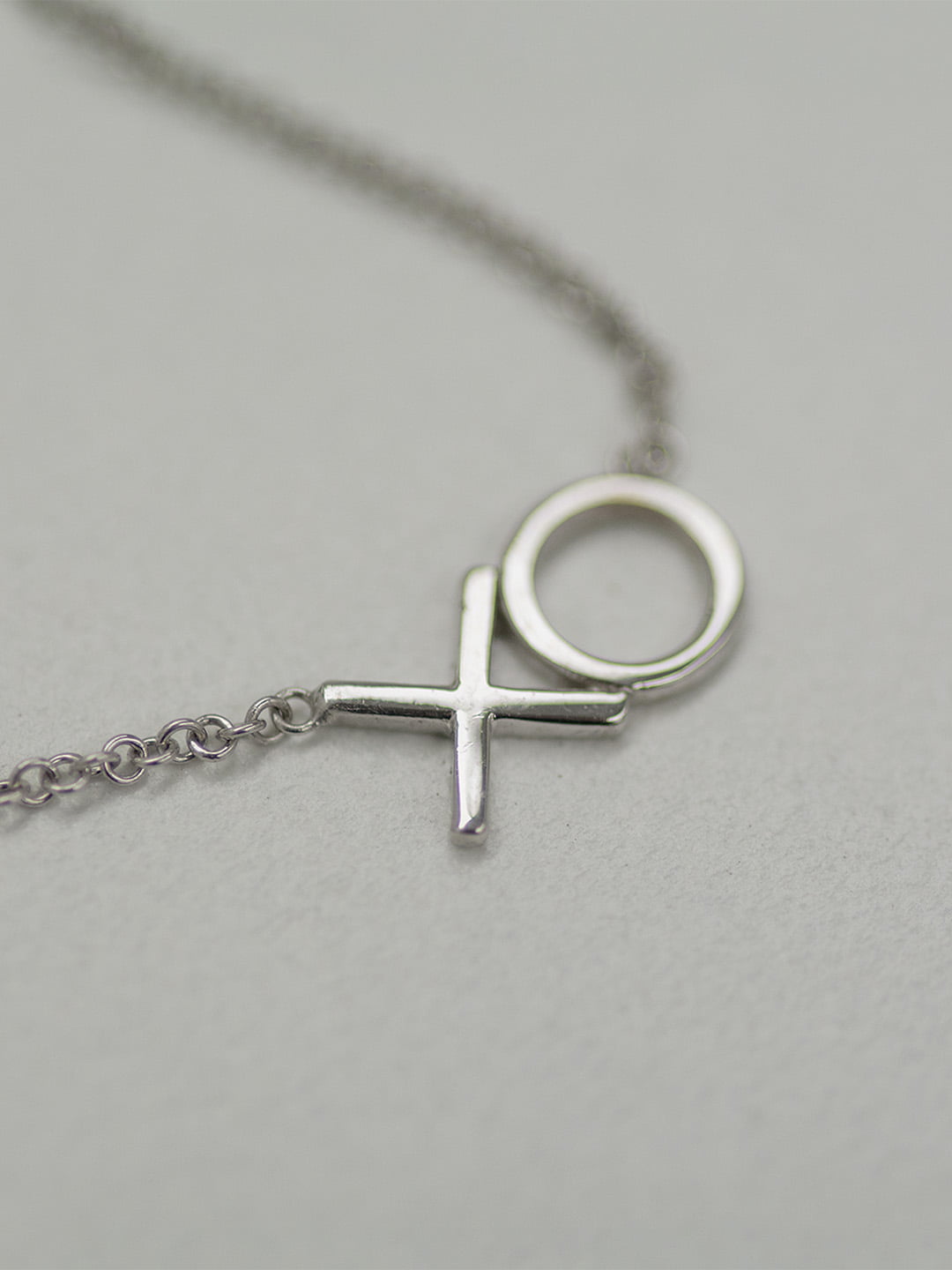 XO Hugs and Kissing Gold Necklace on white background
