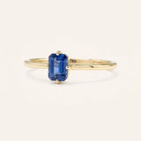 Yellow gold Daylily blue sapphire ring side view on white background