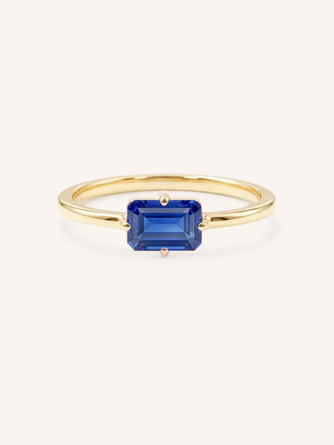 Yellow Gold Ladys Mantle Blue Sapphire Ring on white background