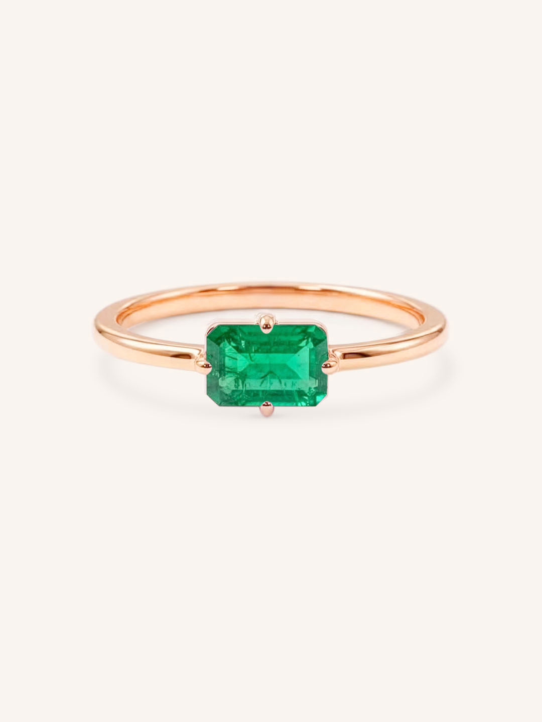 Rose Gold Ladys Mantle Emerald Ring on white background