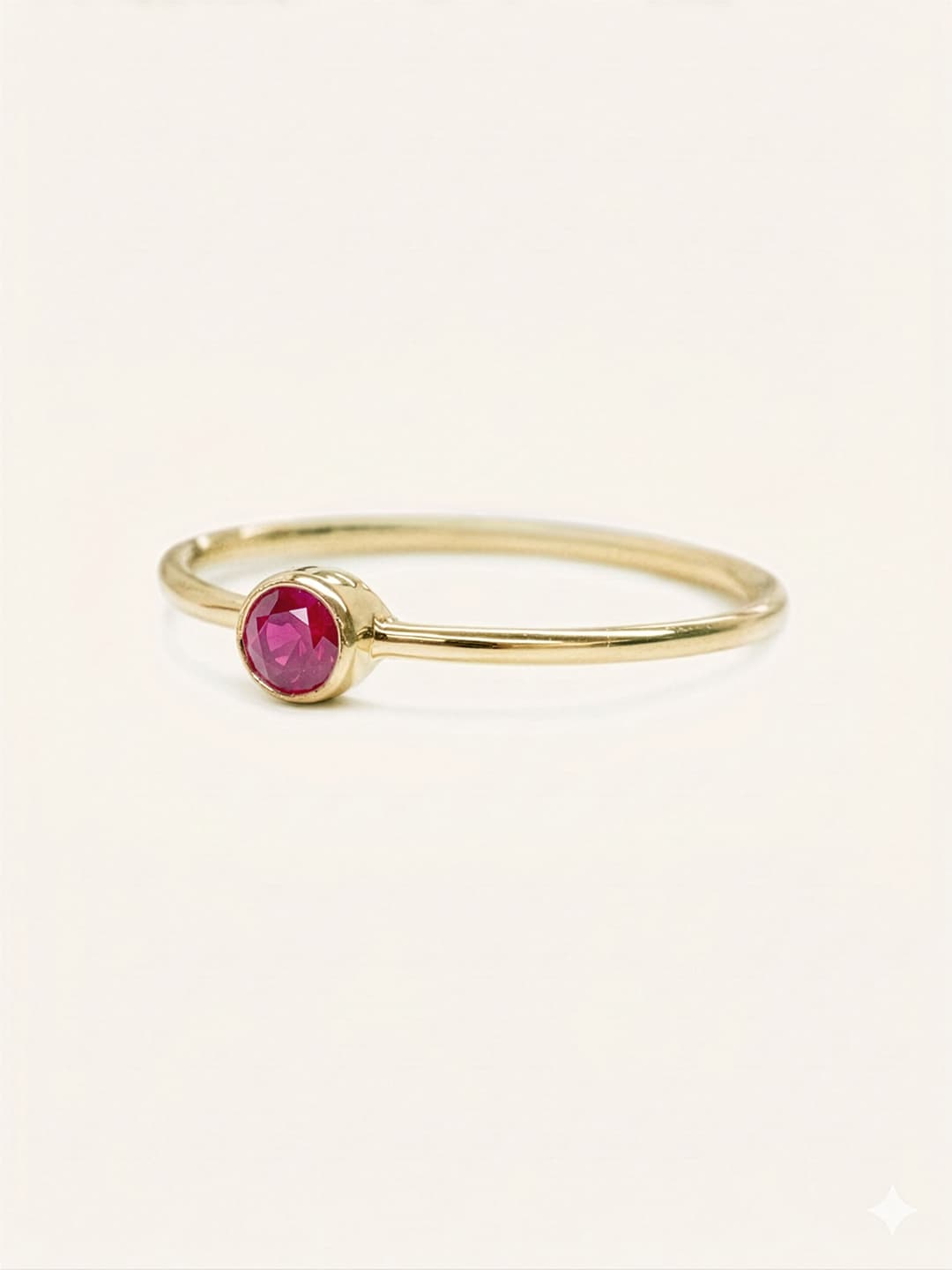 Yellow gold Autumn Lane ruby ring side view on white background
