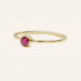 Yellow gold Autumn Lane ruby ring side view on white background