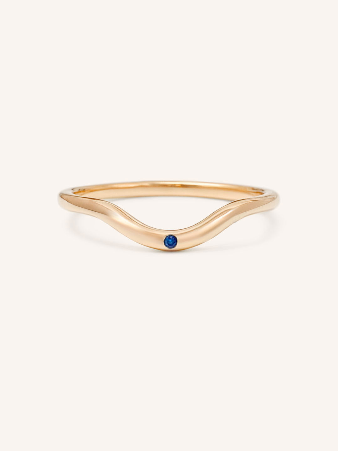 Rose gold Seasalt single blue sapphire curved ring front view on white background