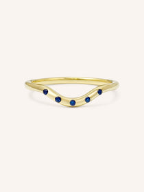 Yellow gold Seasalt five blue sapphire curved ring front view on white background