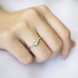 Blushing Bride Round Moissanite Three Stone Engagement Ring