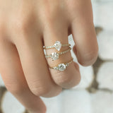 Blushing Bride Round Moissanite Three Stone Engagement Ring