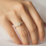 Blushing Bride Round Moissanite Three Stone Engagement Ring