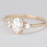 Blushing Bride Moissanite Pear Three Stone Engagement Ring