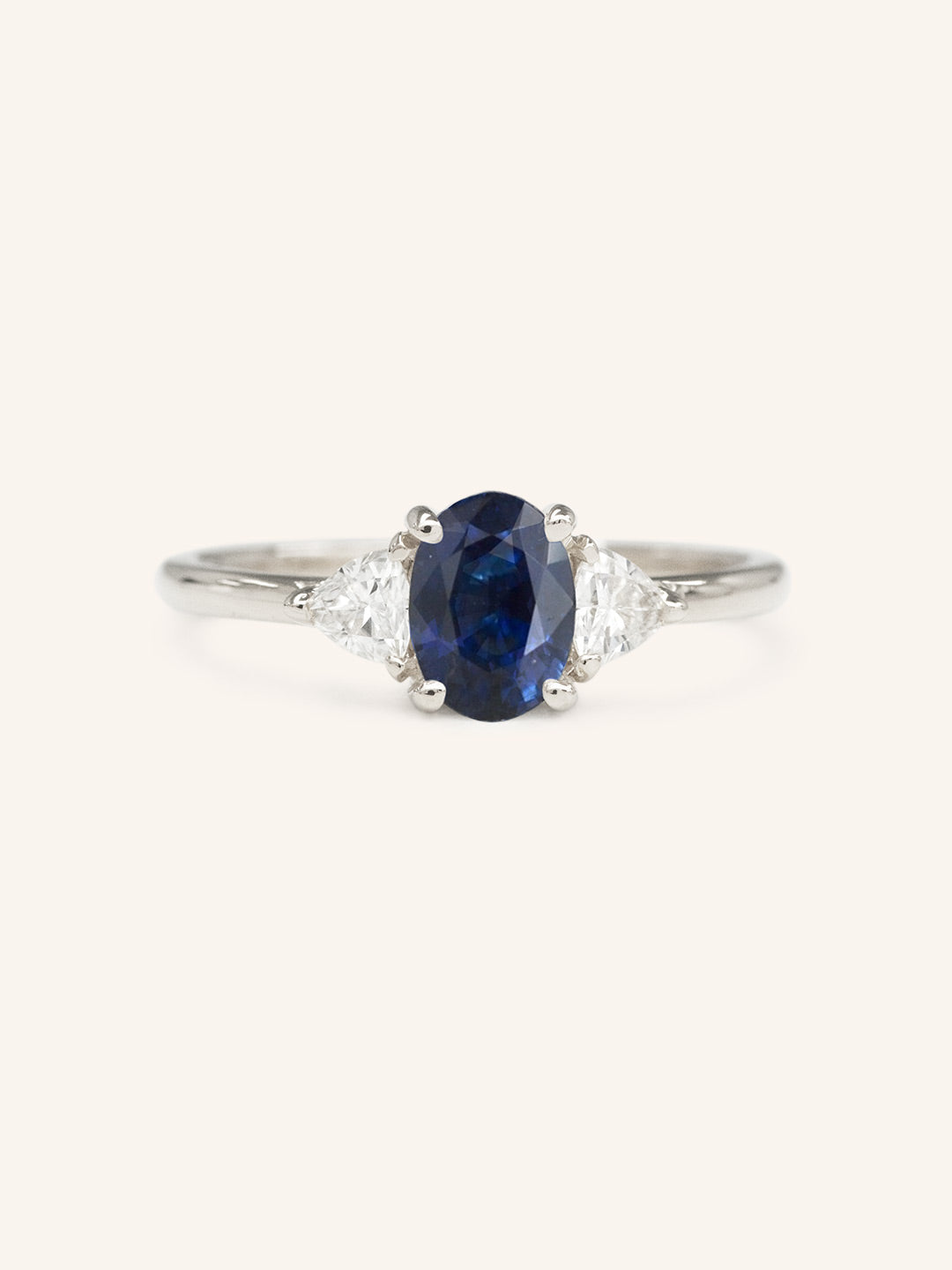 Lux Blue Oval Blue Sapphire Trillion Moissanite Three Stone Engagement Ring