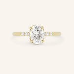 Yellow Gold Hidden Halo Oval Moissanite Engagement Ring with Diamond Accents front view on white background