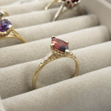 Hidden Halo Marquise Garnet Engagement Ring with Diamond Accents