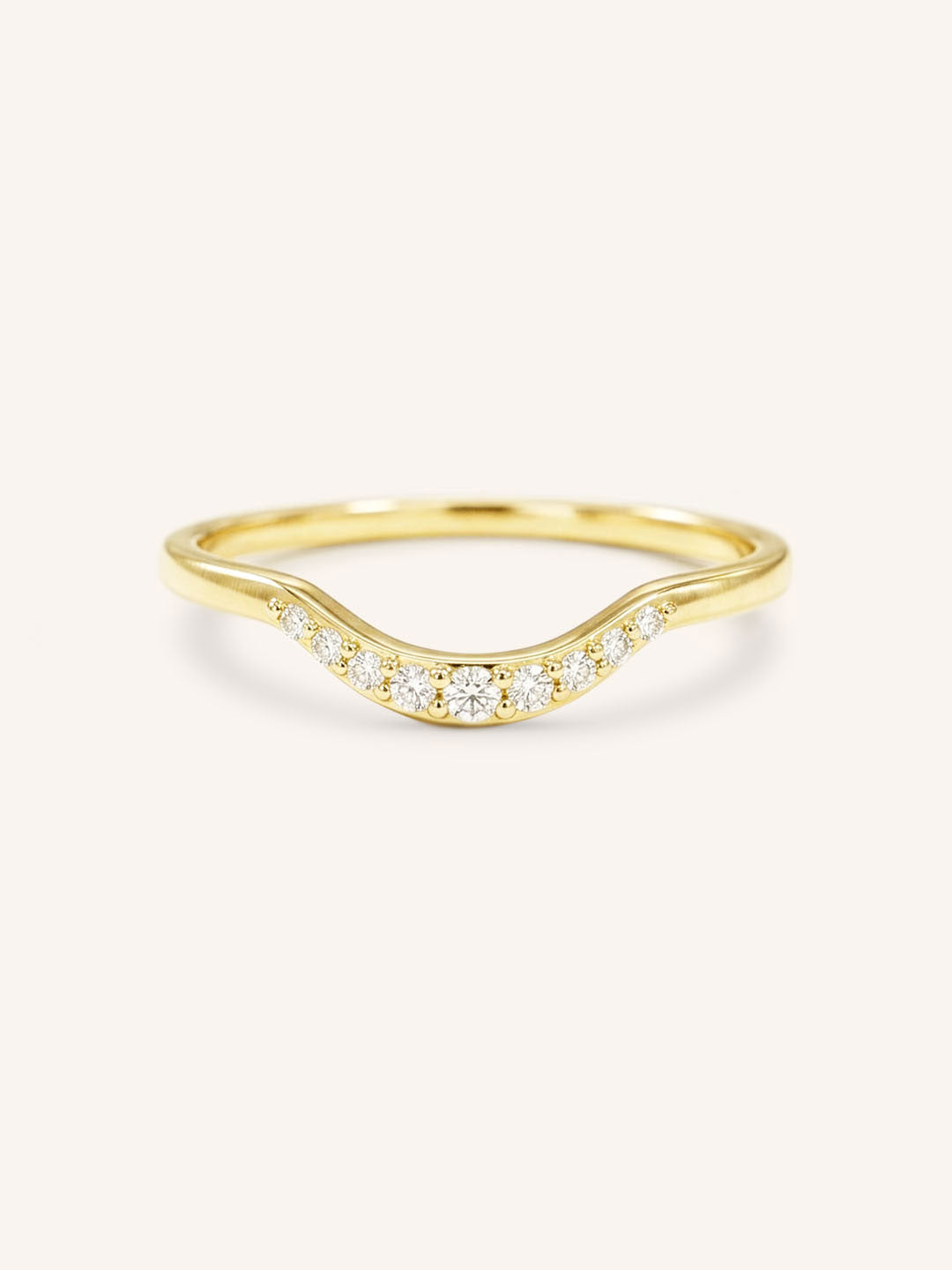 Yellow gold Cassidy curved diamond wedding band front view on white background