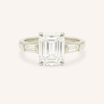 White gold Stately Manor emerald cut diamond three stone engagement ring with baguette accents front view