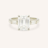 White gold Stately Manor emerald cut diamond three stone engagement ring with baguette accents front view