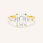 Yellow gold Stately Manor emerald cut diamond three stone engagement ring with baguette accents front view