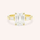 Yellow gold Stately Manor emerald cut diamond three stone engagement ring with baguette accents front view