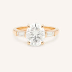 Rose gold Stately Manor oval diamond three stone engagement ring with baguette accents front view