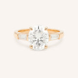 Rose gold Stately Manor oval diamond three stone engagement ring with baguette accents front view