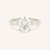 White gold Stately Manor oval diamond three stone engagement ring with baguette accents front view
