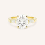 Yellow gold Stately Manor oval diamond three stone engagement ring with baguette accents front view