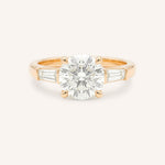 Rose gold Stately Manor round diamond three stone engagement ring with baguette accents front view