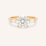 Rose gold Stately Manor round diamond three stone engagement ring with baguette accents front view