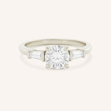 Stately Manor Round Moissanite Tapered Baguette Three Stone Engagement Ring