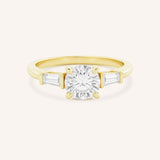 Stately Manor Round Moissanite Tapered Baguette Three Stone Engagement Ring