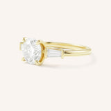 Stately Manor Round Moissanite Tapered Baguette Three Stone Engagement Ring