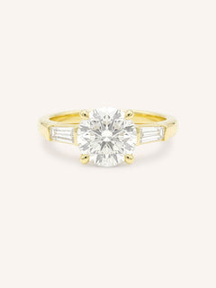 Yellow gold Stately Manor round diamond three stone engagement ring with baguette accents front view