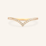 A V-shaped diamond ring with a solid gold band, set with sparkling diamonds.