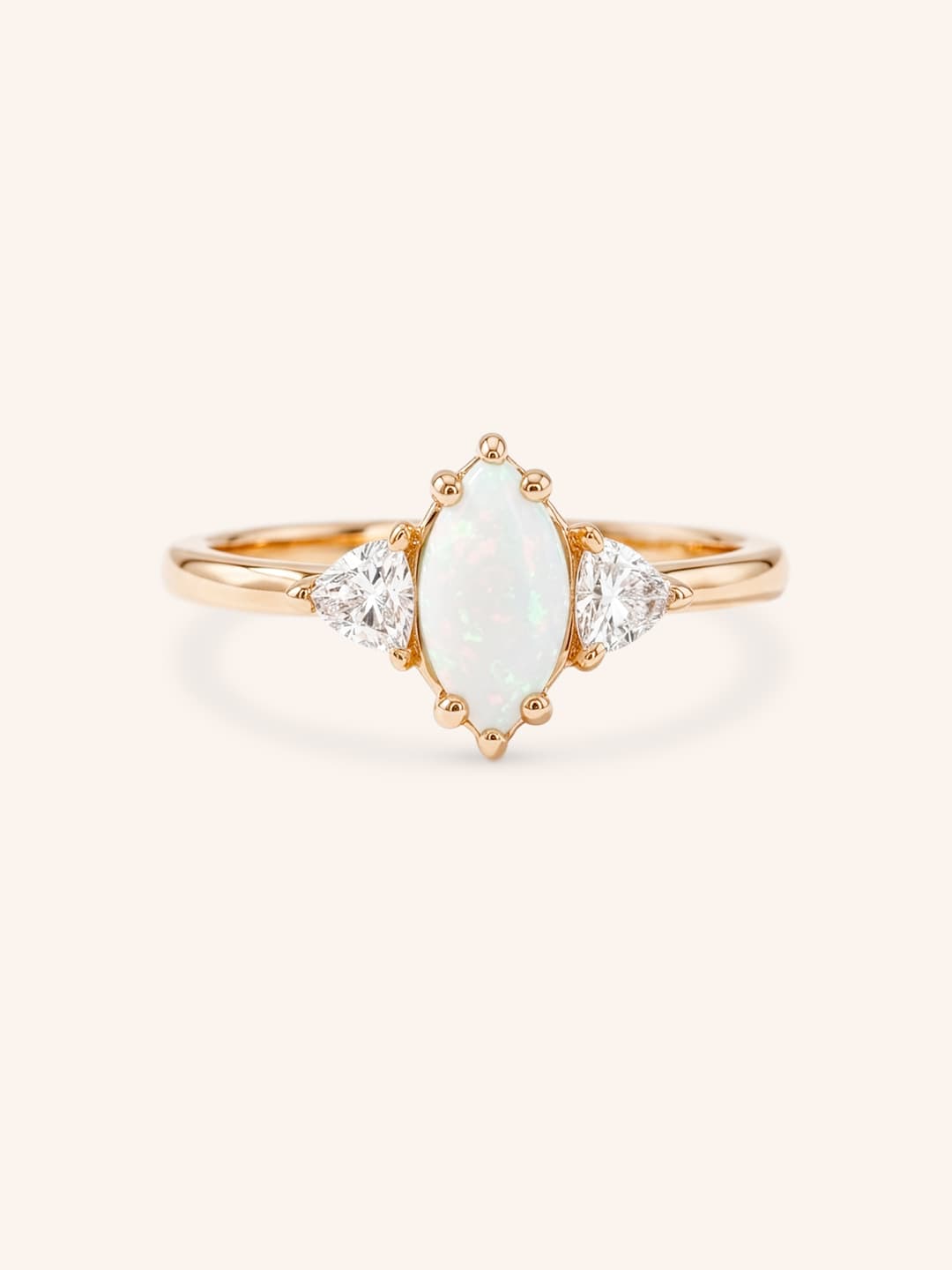 Rose gold Cassidy marquise opal and trillion diamond engagement ring front view on white background