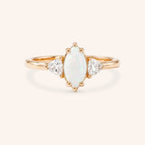 Rose gold Cassidy marquise opal and trillion diamond engagement ring front view on white background